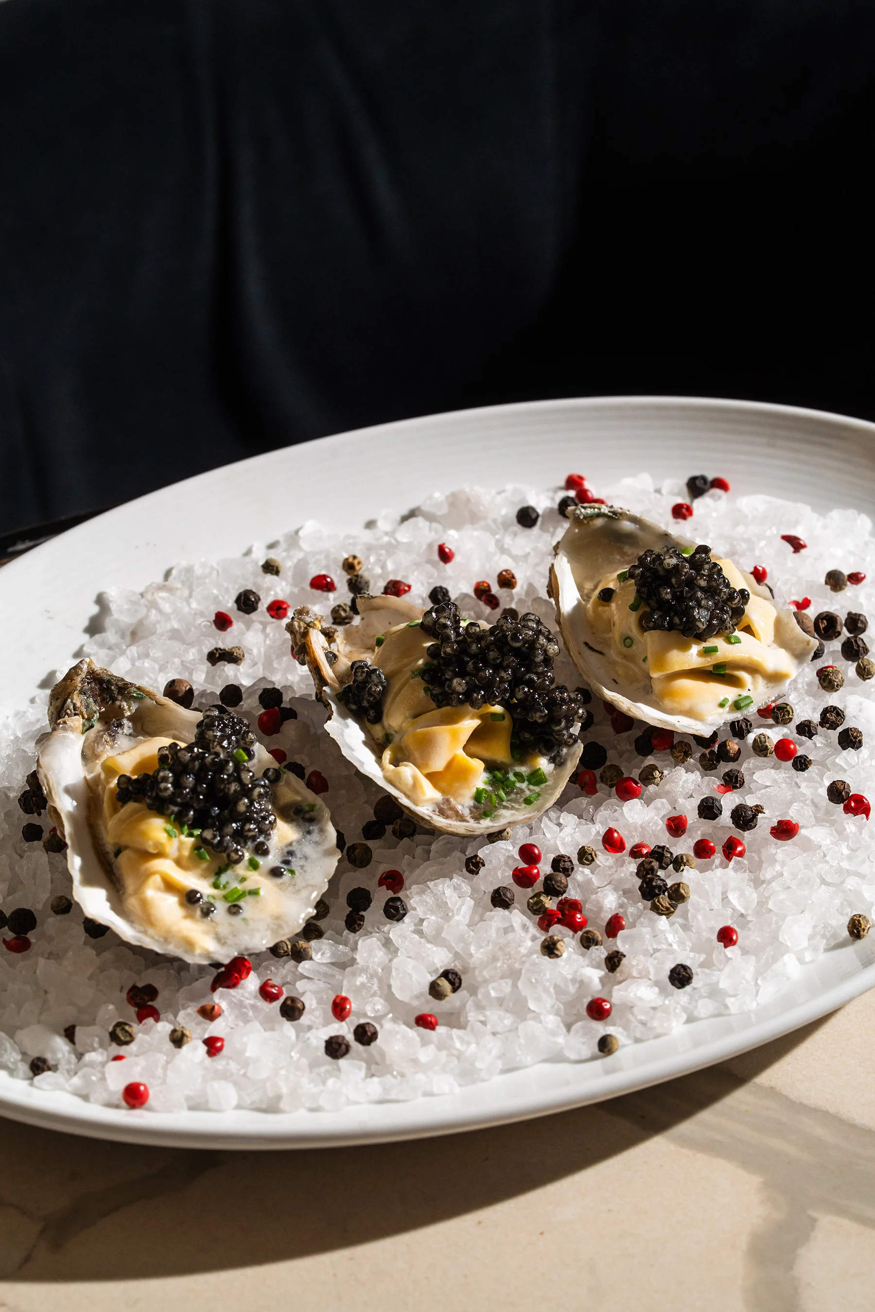 Oysters topped with caviar