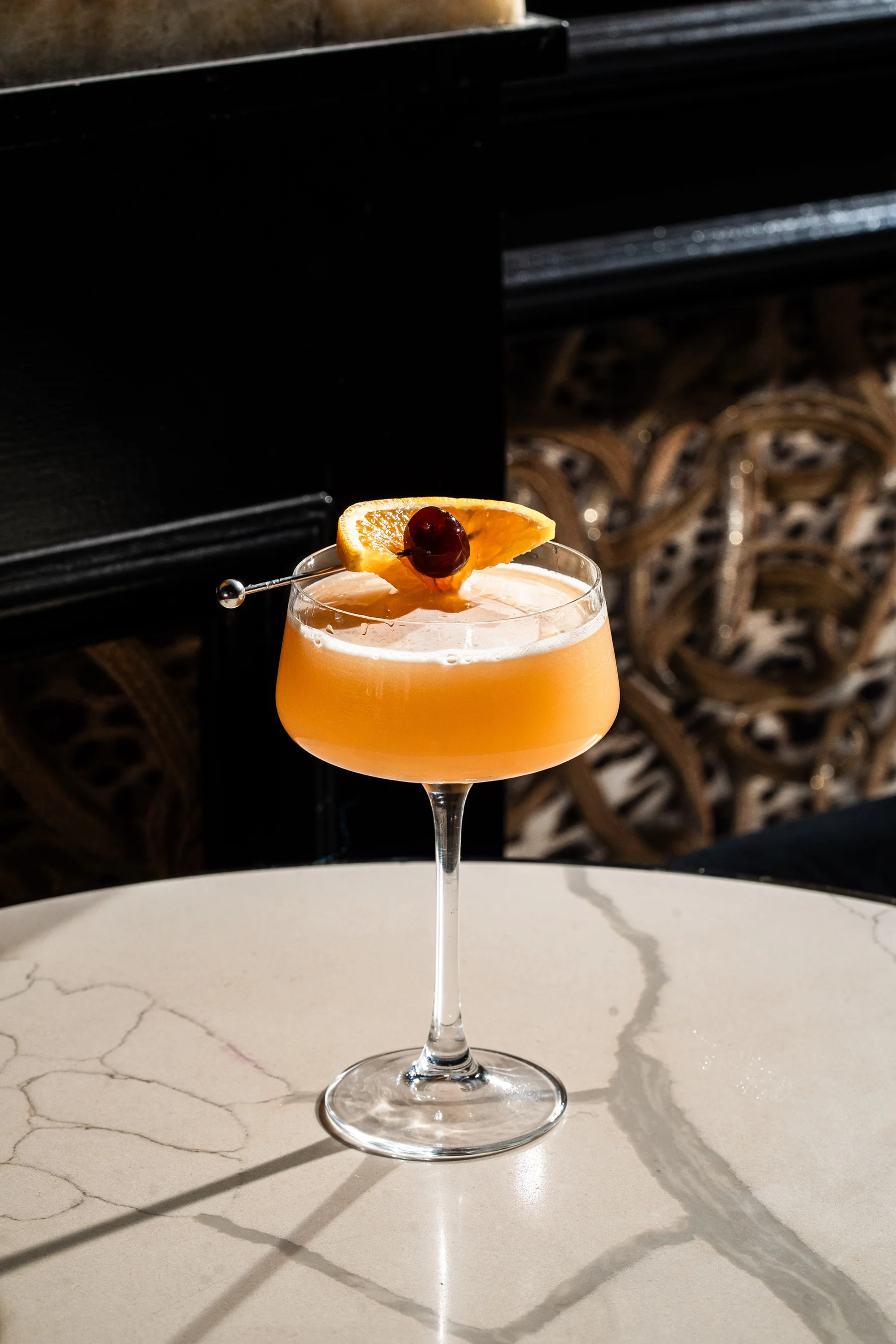 Orange garnished cocktail